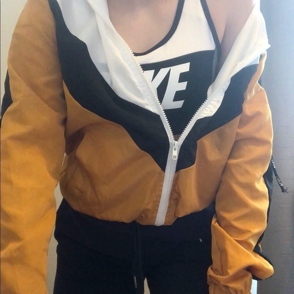 yellow, black, white windbreaker jacket